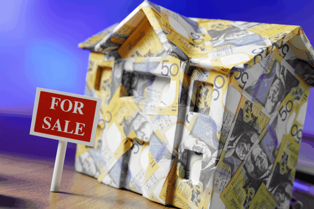 House wrapped in cash with a for sale sign.