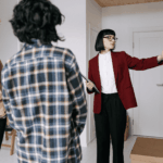 Real estate agent showing a home interior to two clients