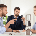 Couple arguing with a real estate agent holding house keys