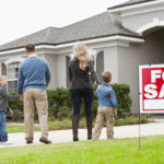 Family viewing a house for sale in a suburban neighborhood.