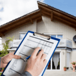 Home inspector reviewing checklist in front of a house.