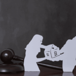 Upset couple standing with a lawyer in an office, suggesting a divorce or legal dispute meeting.