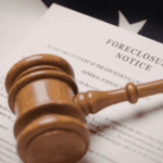 Judge’s gavel resting on a document labeled “Foreclosure Notice.”