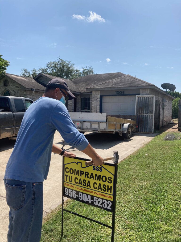 Pedro-with-company-sign