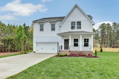 Picture of a two-story traditional house in Norfolk, VA on a sunny day.