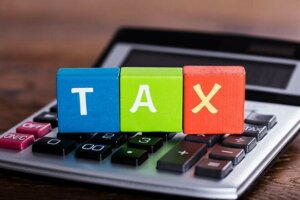 Tax word on a calculator keyboard