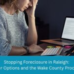 Raleigh, NC homeowner reviewing foreclosure options and mortgage documents in Wake County