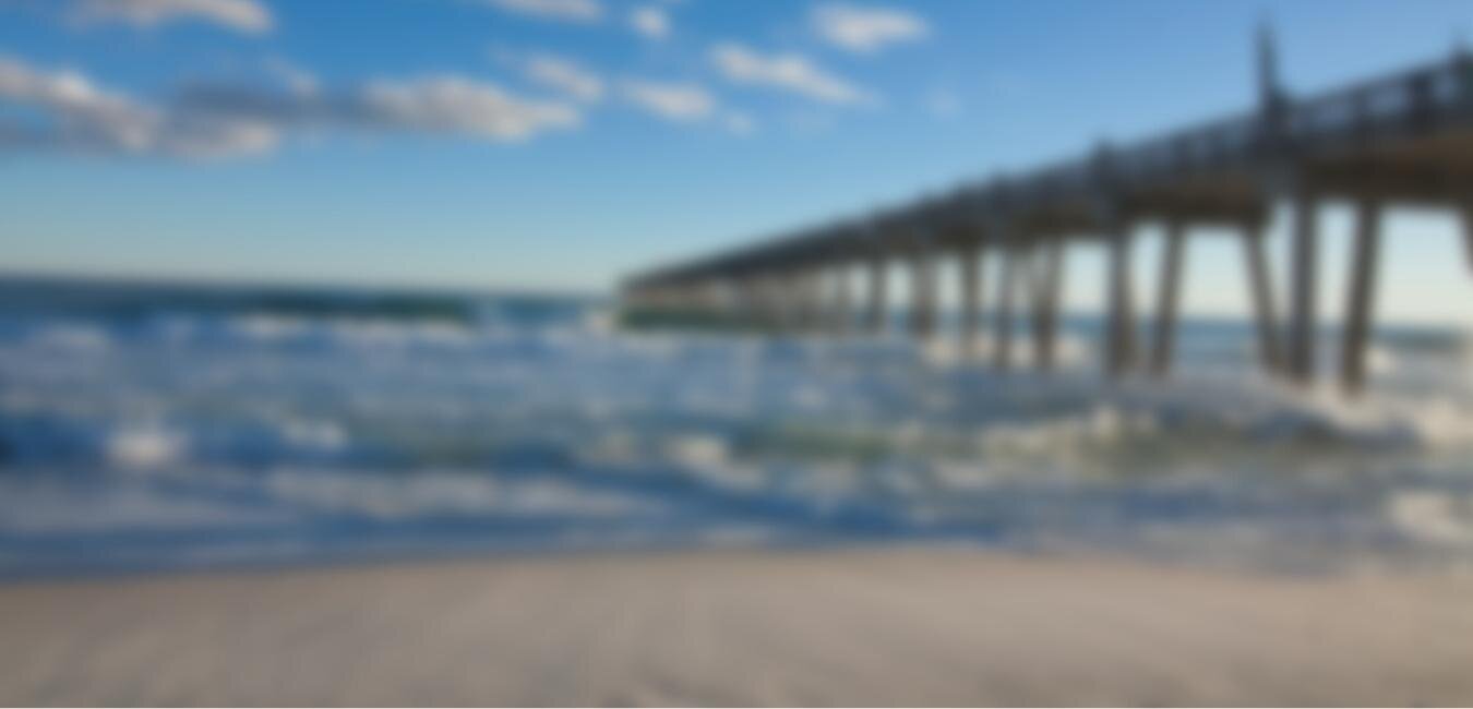 An out of focus picture of the Pensacola Beach Peer taken from the beach. 
