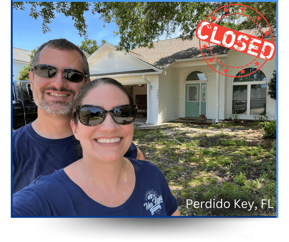 Anne & Mike Laurenzi in front of a house they purchased in Perdido Key, FL.