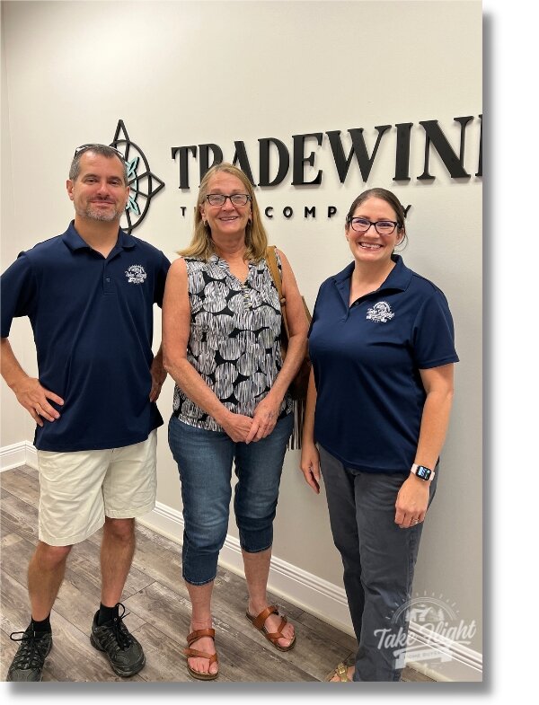 Mike and Anne with customer at closing.