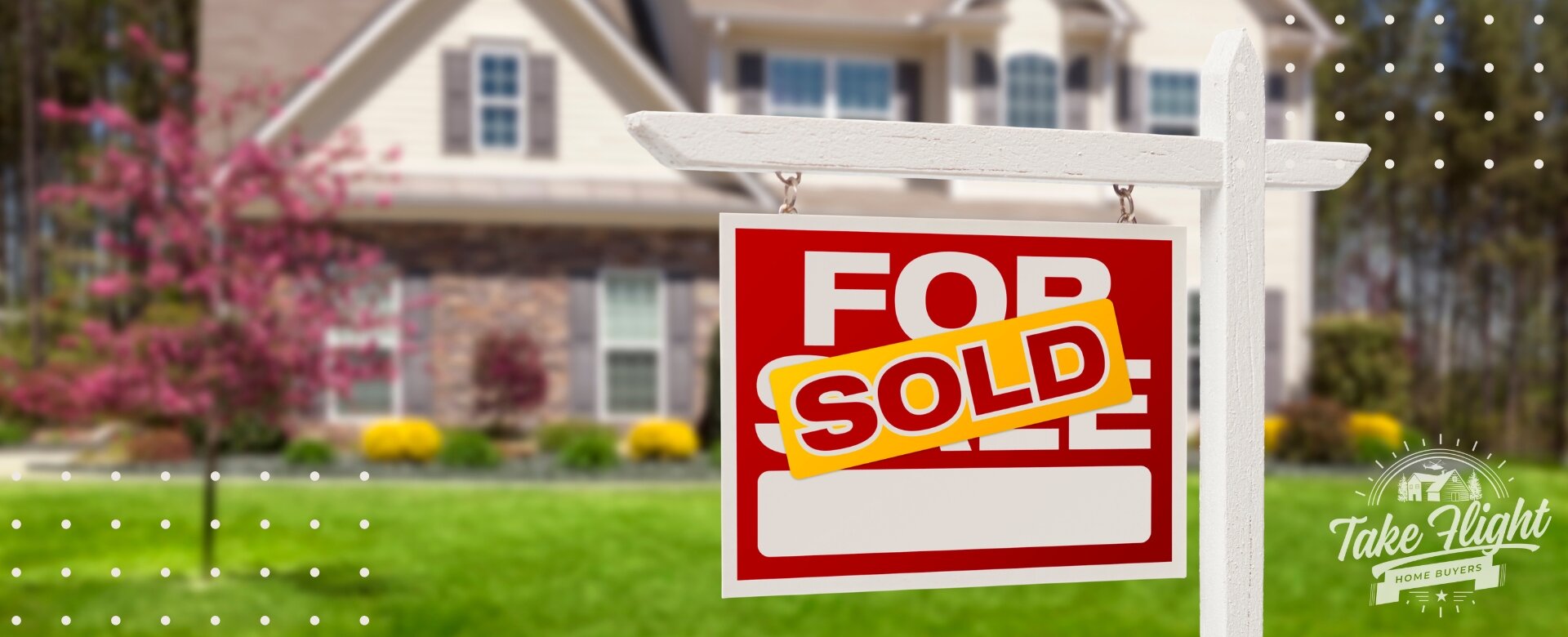 For Sale sign marked "SOLD" in front of house.