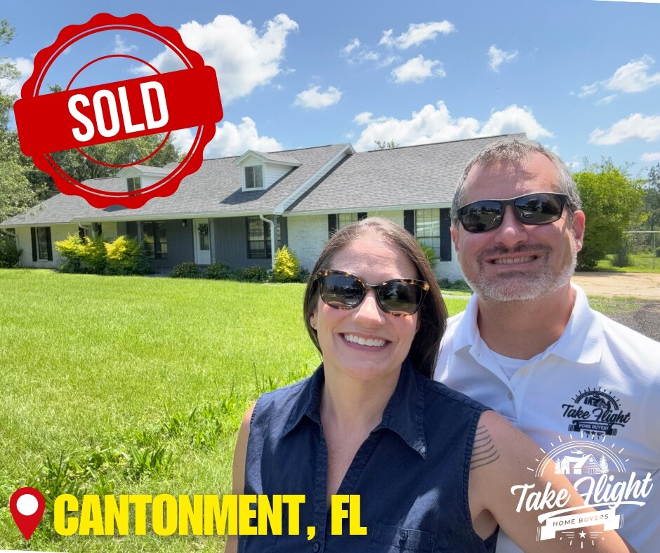 Anne & Mike standing in front of a house with a "sold" badge in the upper left corner, Cantonment, FL in the lower left, and Take Flight Home Buyer's logo in the lower right.