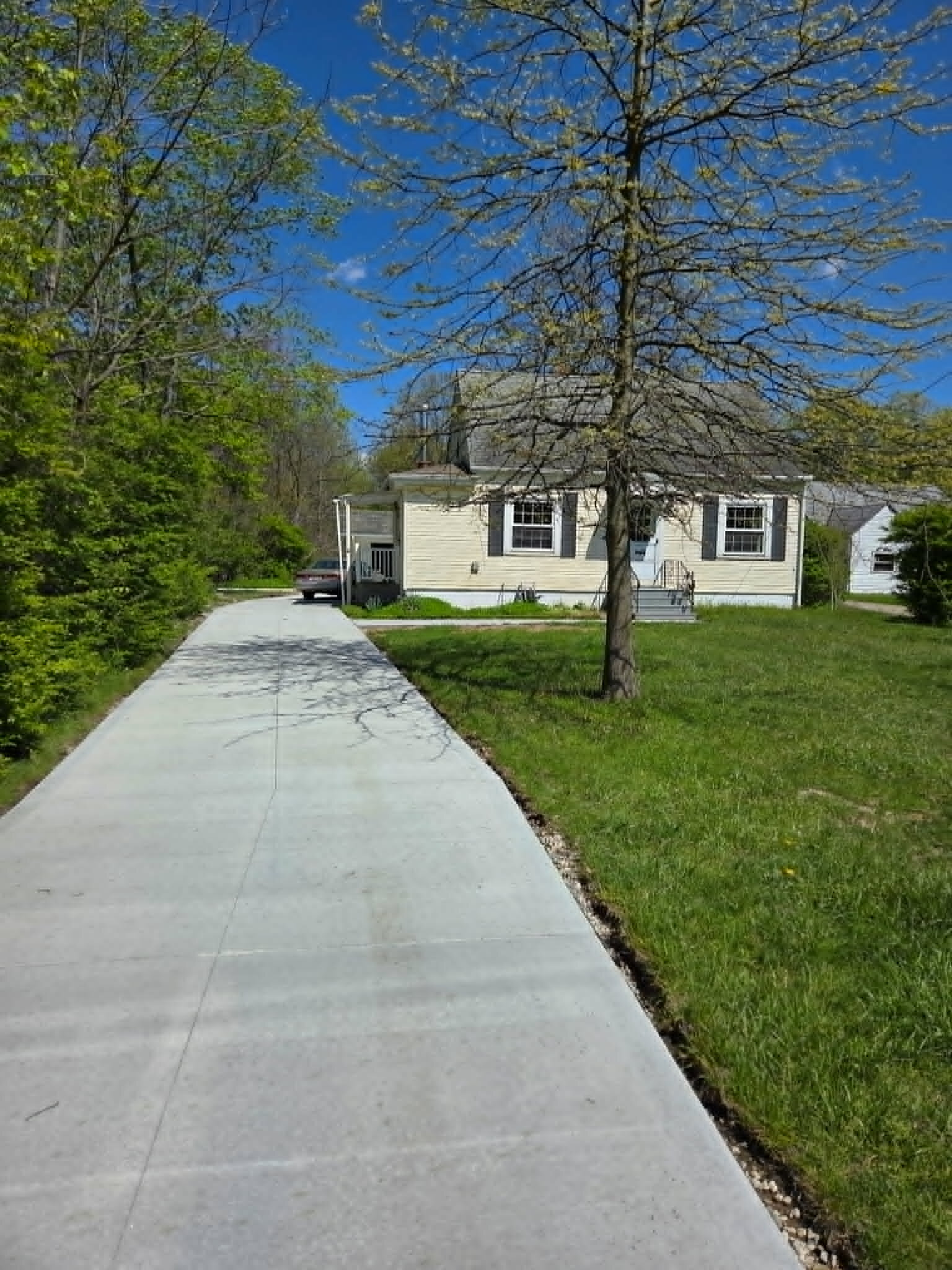 The Oakwood Village property after major cleanup and exterior improvements. The street address is intentionally omitted.