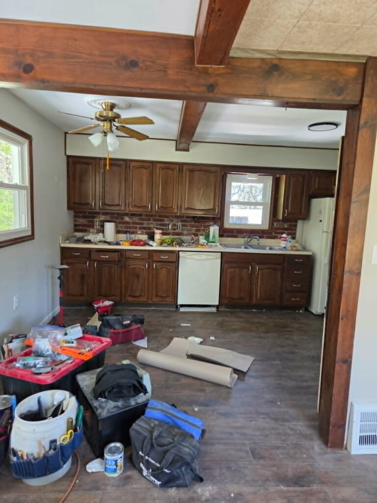 Kitchen and adjoining living area during a major Oakwood Village house renovation.