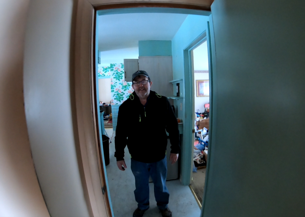 Kelly McEntire of Legacy Home Solutions walking through a house in Stow Ohio.