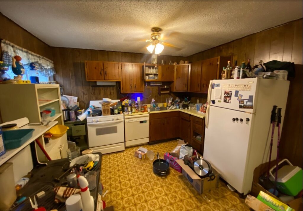 Dated kitchen in a De Soto house before renovation