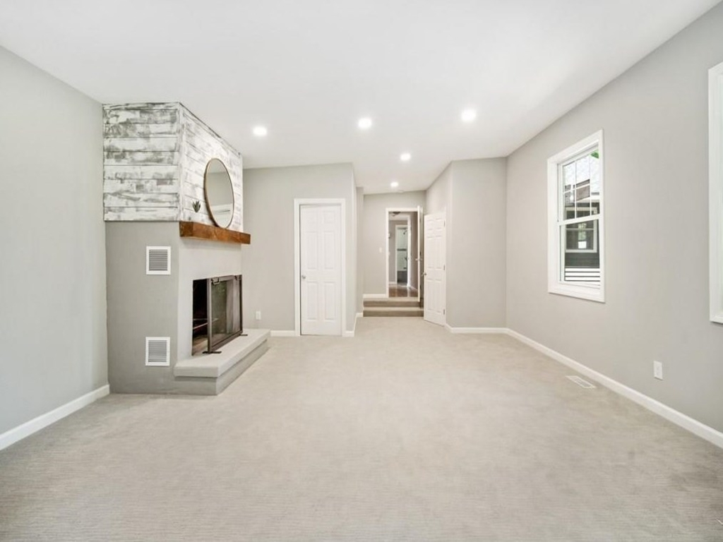 This is an after photo of a living room in a home that Revival Homebuyers purchased for cash in Chicopee MA