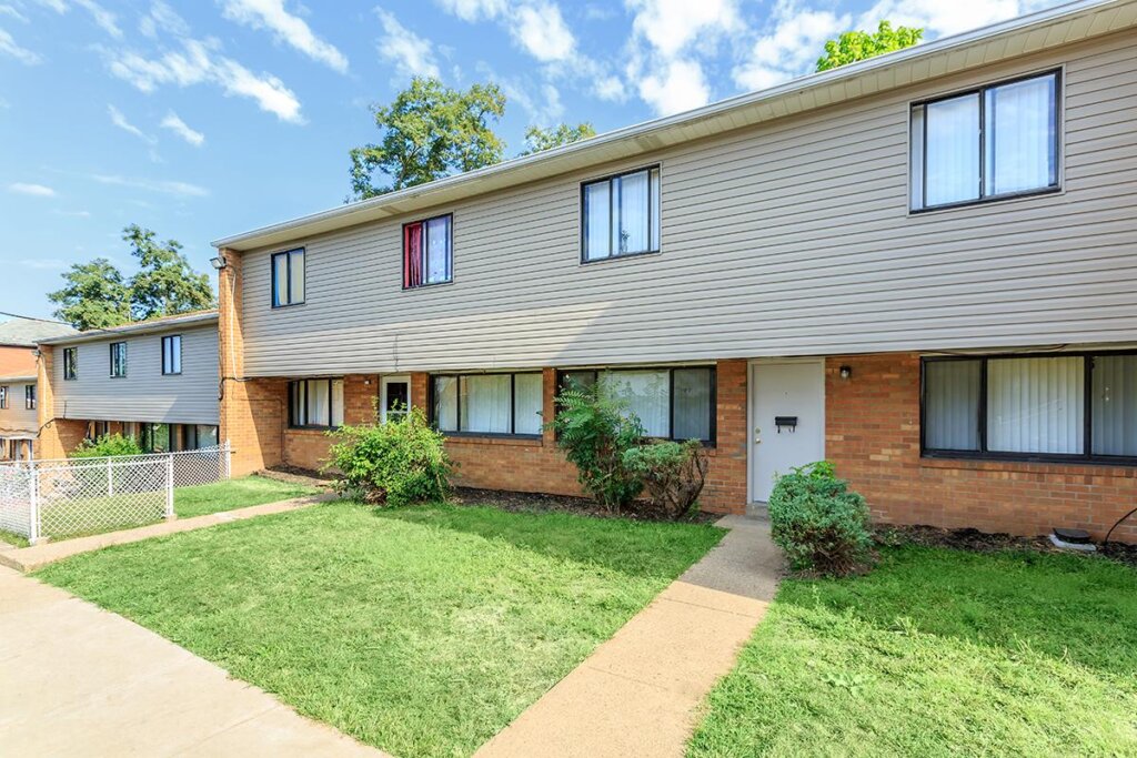 Modern low-income apartment complex with landscaped surroundings, exemplifying affordable housing options