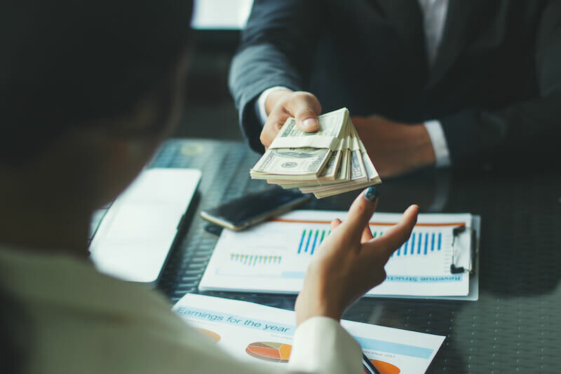 cash home buyer paying with cash