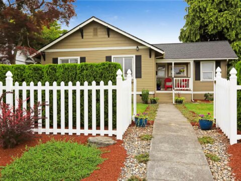 house exterior with picket fence