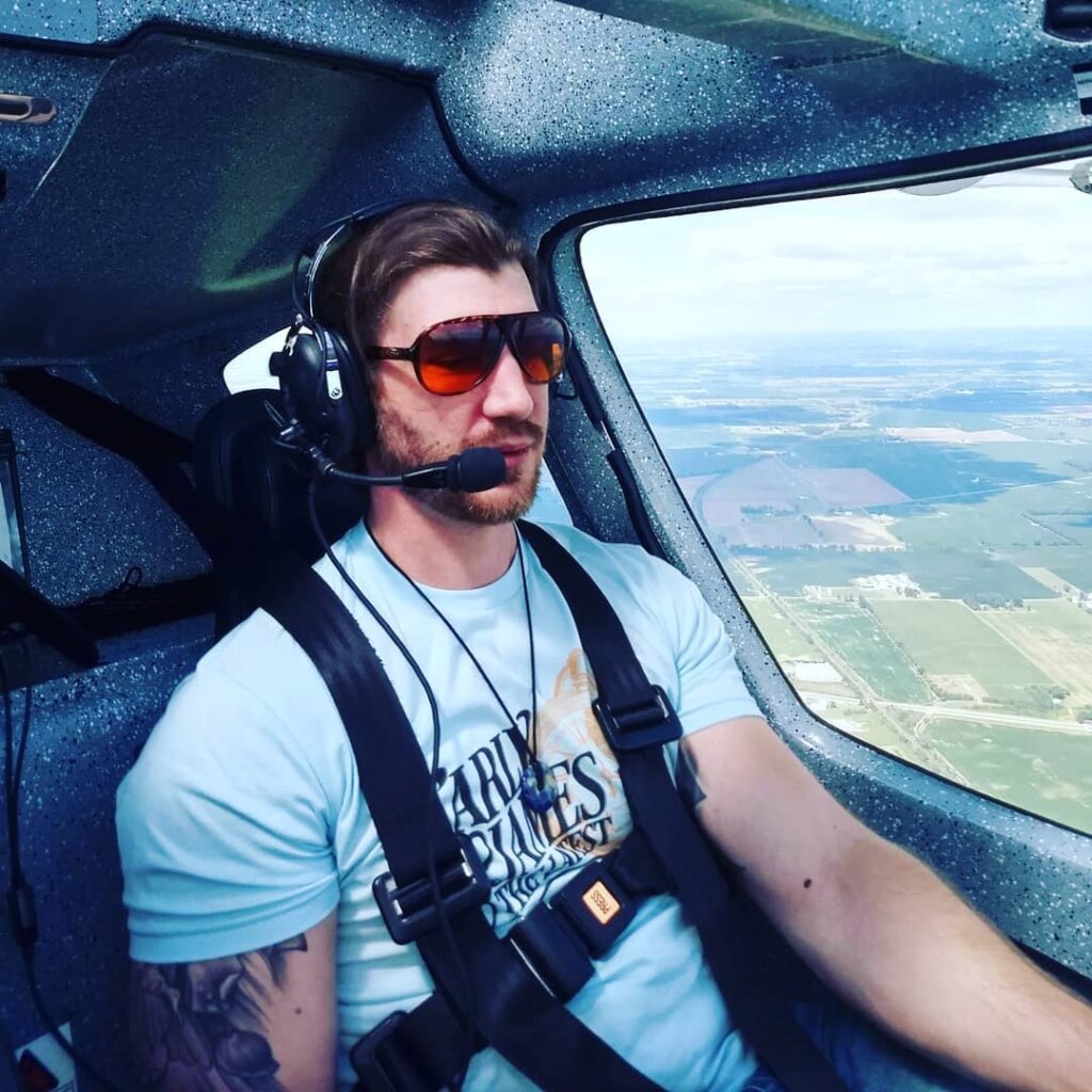 Home Sell Ohio owner Eric Pifer flying a plane.