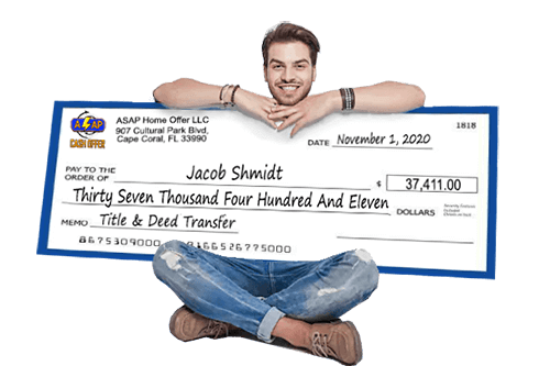 Man Sitting With a Check for Selling His Home For Cash