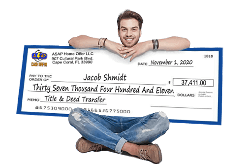 Man Sitting With a Check for Selling His Home For Cash