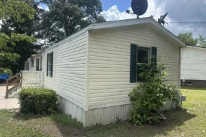 Who buys mobile homes in my area light gray home in quiet neighborhood