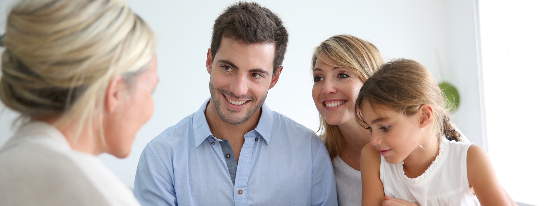 A family looking at a home plan together