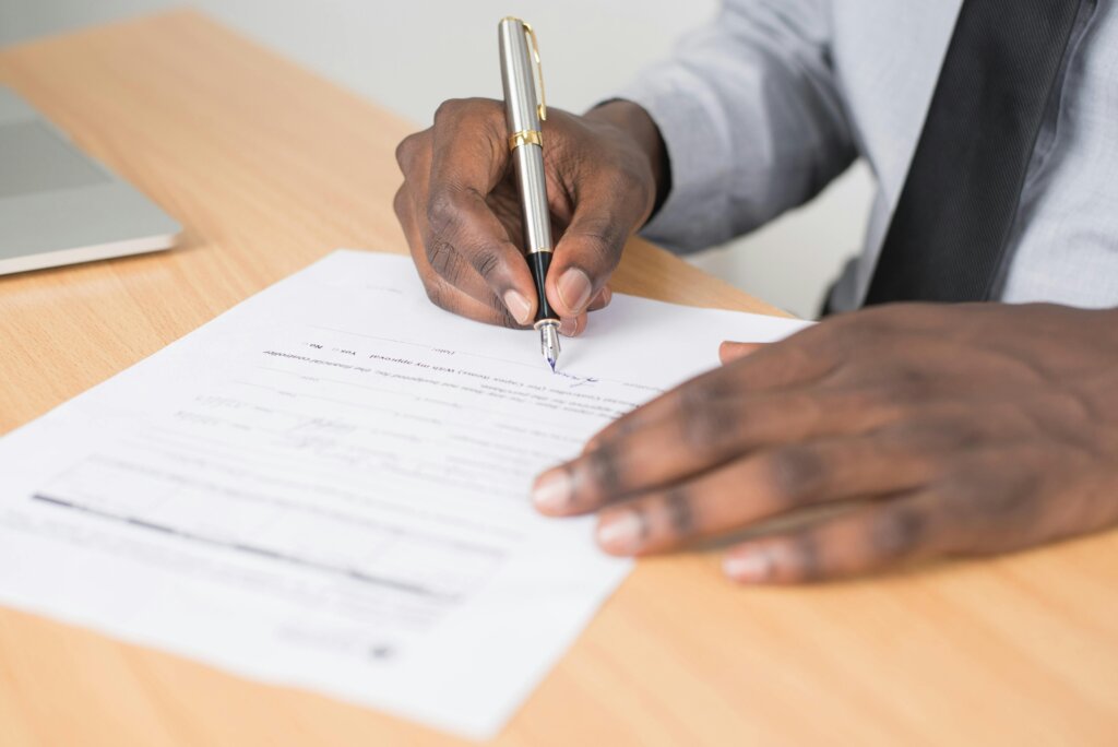 person holding gray twist pen
