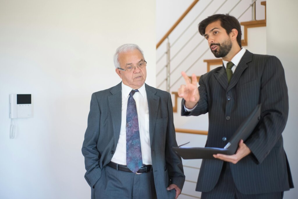 a realtor explaining to an elderly man