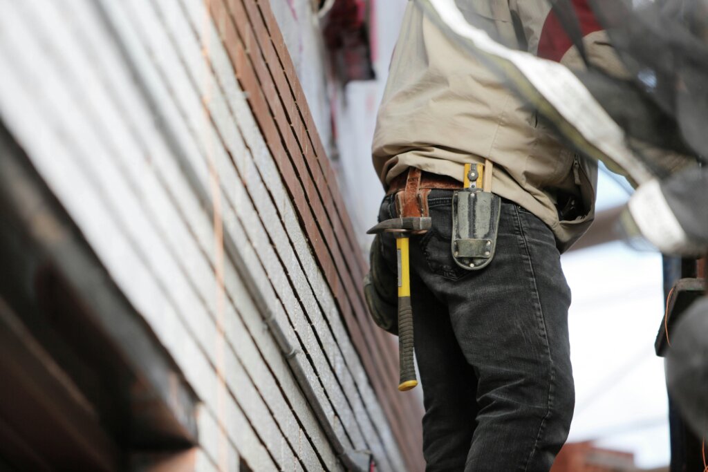 man repairing house