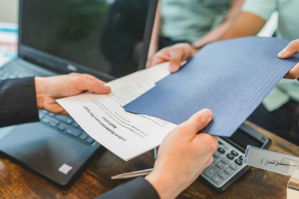 real estate agent giving documents
