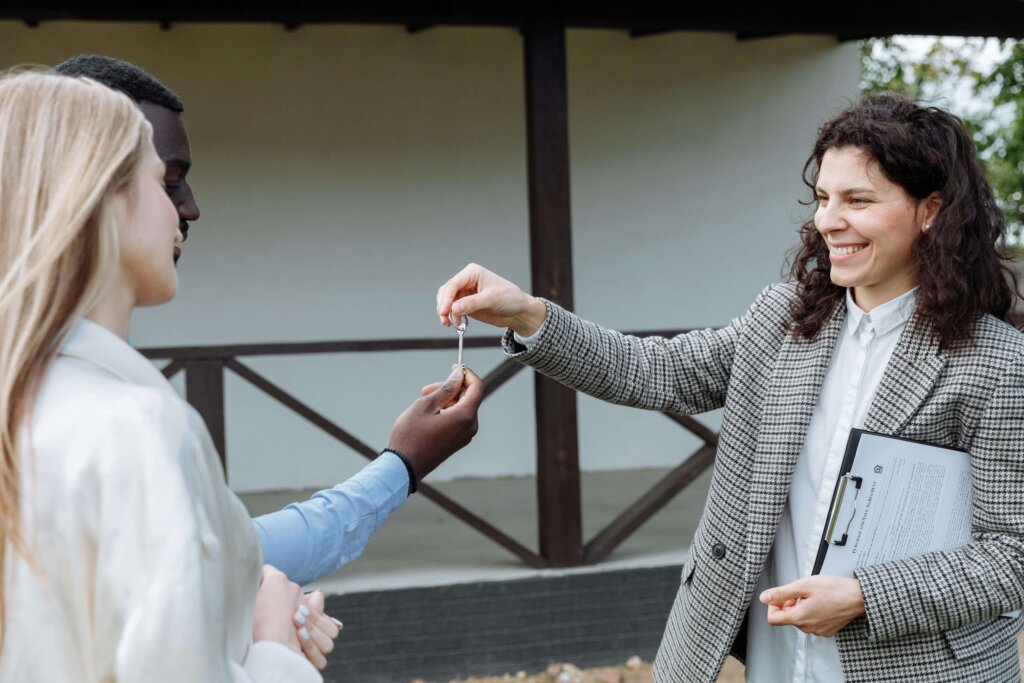 an agent handing the key