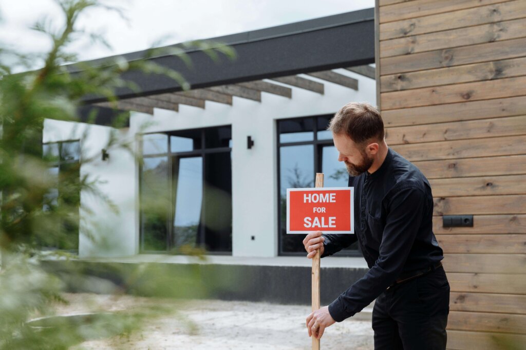 a man removing the signage