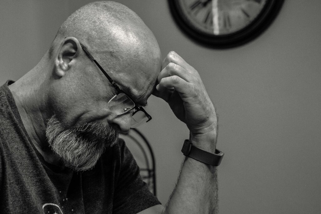 grayscale photo of man thinking