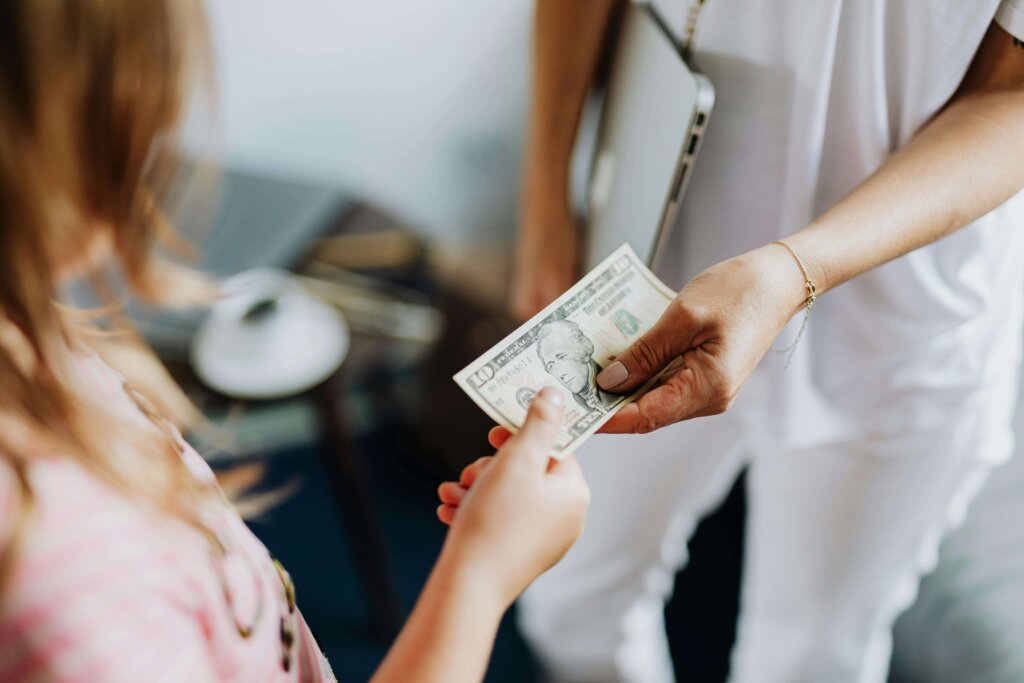 hands holding us dollar bill