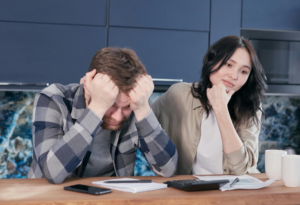 stressed couple sitting at the table