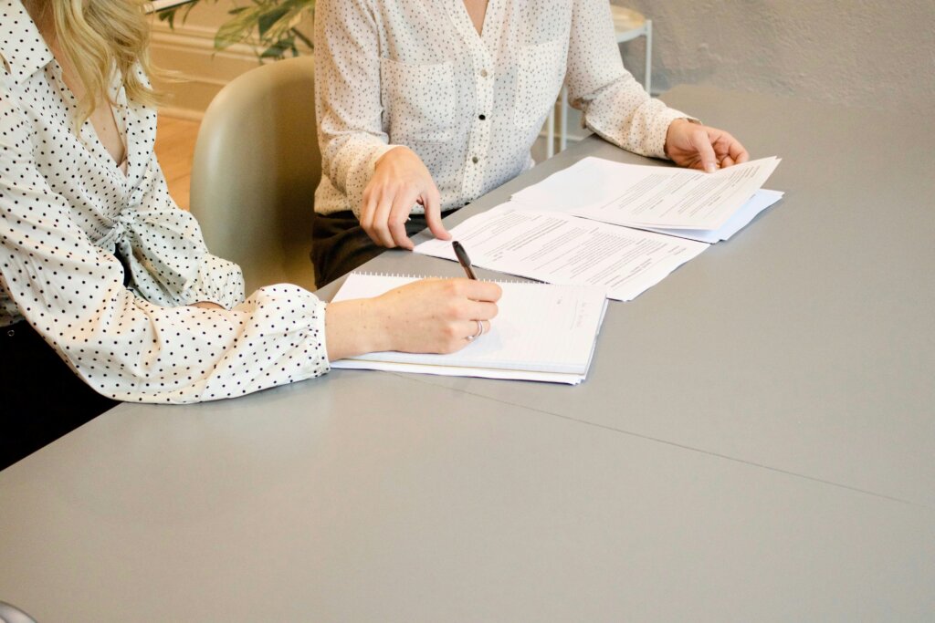 woman signing document