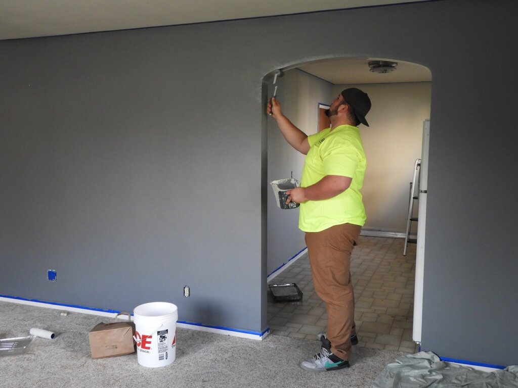 a man painting a house
