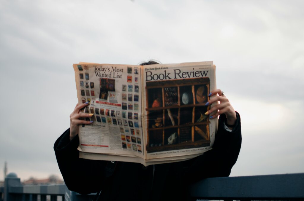 a person holding newspaper