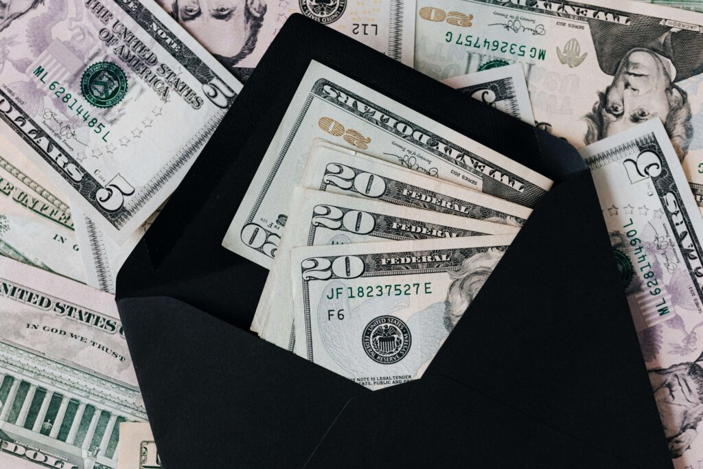 black envelope and dollar bills