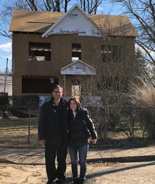 Josh and Elana in front of a new home they built in 2016