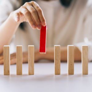 woman picking up a red vertical block cash offer on your home virginia