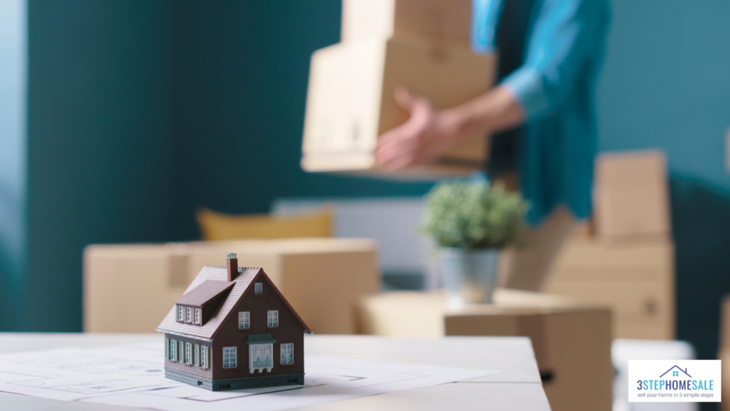 Miniature house with boxes at the background cash for your house virginia