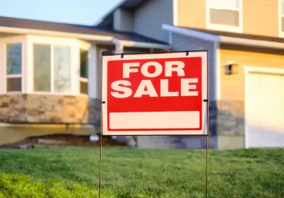A for sale sign is displayed in front of a house, symbolizing the selling a house during probate.