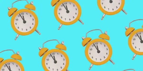 A vibrant pattern featuring yellow clocks scattered across a bright blue background