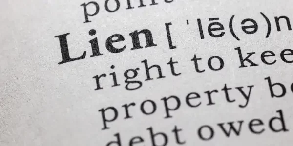 Can I sell a property with liens on it?