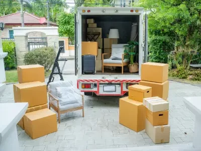 a truck loaded with home appliances and furnitures