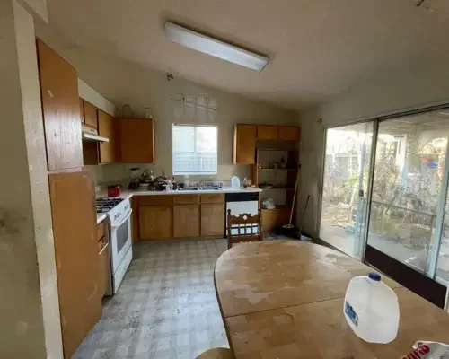 Old kitchen style, brown cabinets and '90s looking tile floor